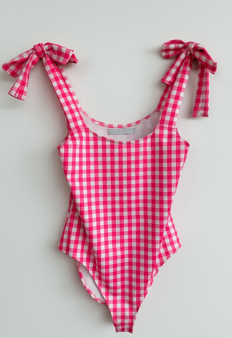 body de mujer de tirantes con lazos con cuadros vichy en color fucsia y tela de lycra